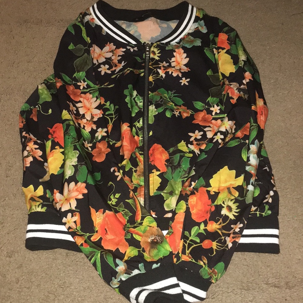 I’m selling a floral bomber style jacket.